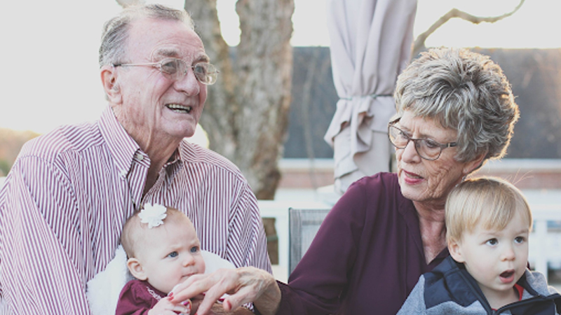 Grandparents Holding Grandchildren